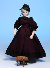 Circa-1850s Mme. Leontine Rohmer poupee with rare swivel neck and cobalt glass eyes, 14 inches, $6,325. Image by Frasher’s Doll Auctions.