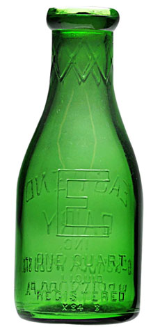 Circa-1934 emerald green glass eggnog bottle from East End Dairy, Harrisburg, Pa.), 9 ¼ inches, near mint, extremely rare, est. $1,500-$3,500. Dan Morphy Auctions image.