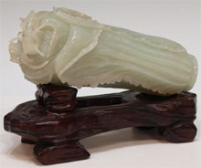 Chinese pale celadon jade carving of a cabbage topped by two crickets, late Qing/early Republic period, 6½ inches long, 3.25 lbs. Provenance: U.S. Army colonel who lived in Asia post World War II. Estimate $3,000-$5,000. Austin Auction Gallery image.