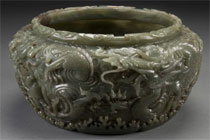Chinese carved jade mortar, 10¼ inches tall, late 19th/early 20th century, spinach-colored jade, motif features scrolling dragons, clouds, waves, sold through LiveAuctioneers.com for $14,760. Image courtesy Jackson’s International.