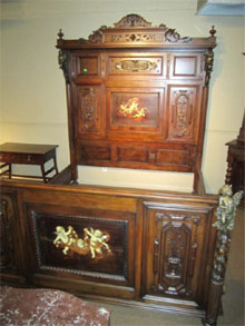 19th-century king-size custom walnut bed inlaid with pearl and ivory, $8,625.