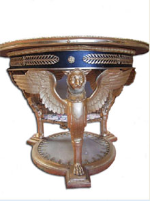 Bronze and onyx table with gilt griffins forming its base, $11,500. Don Presley Auctions image.