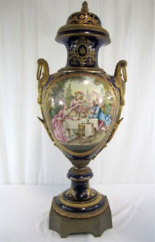 Sevres 19th century lidded urn, 40 inches tall. Don Presley Auctions image.