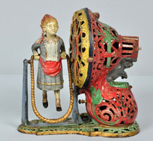 J. & E. Stevens Girl Skipping Rope cast-iron mechanical bank, $16,000-$22,000. Morphy Auctions image.