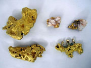 Six gold nuggets ranging in size from 2 ozt. to 12.86 ozt. Don Presley Auctions image.