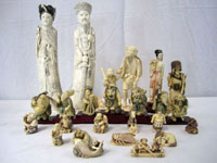 Selections from a vast array of Asian carved ivory that includes king and queen figures, a set of 7 immortals, chess set and collection of 100 netsukes. Don Presley Auctions image.