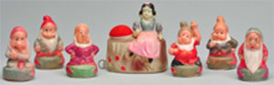 Set of Snow White and (6) Dwarfs celluloid tape measures, est. $2,000-$3,000. Morphy Auctions image.