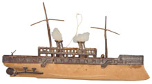 Dresden Christmas ornament of a freighter with billowing smokestacks, est. $2,000-$3,000. Morphy Auctions image.