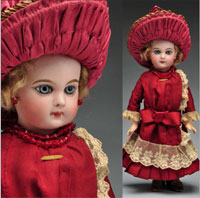 Beautifully dressed early Jumeau bebe doll, 14 in., French bisque socket head incised ‘Depose E 5 J.’ Est. $6,500-$8,500. Morphy Auctions image.