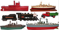 A sampling of the many scarce Buddy L toys, boats and trains, plus (upper right) a rare 37-inch Orkin battleship. Old Town Auctions image.