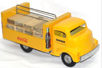 Smith-Miller pressed-steel and wood Coca-Cola delivery truck, complete with wood Coke crates. John W. Coker Auctions image.