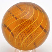 Amber glass latticino swirl marble, 1 5/8 inches in diameter with 14 birdcage latticino bands, ex Paul Baumann collection, est. $4,000-$6,000. Morphy Auctions image.