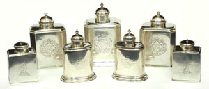 A formidable array of early 18th-century English sterling silver tea caddies. Stephenson’s Auctioneers image.
