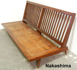 Nakashima 1954 walnut sofa from a living room suite to be auctioned in three lots. Stephenson’s Auctioneers image.