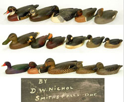 Collection of 16 hand-carved and painted duck decoys by D.W. “Davey” Nichol (1890-1977) of Smiths Falls, Ontario, Canada. Stephenson’s Auctioneers image.