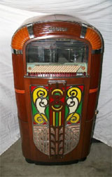 1940s Rock-Ola jukebox with illuminating Art Deco façade, est. $5,100-$10,200. Government Auction image.