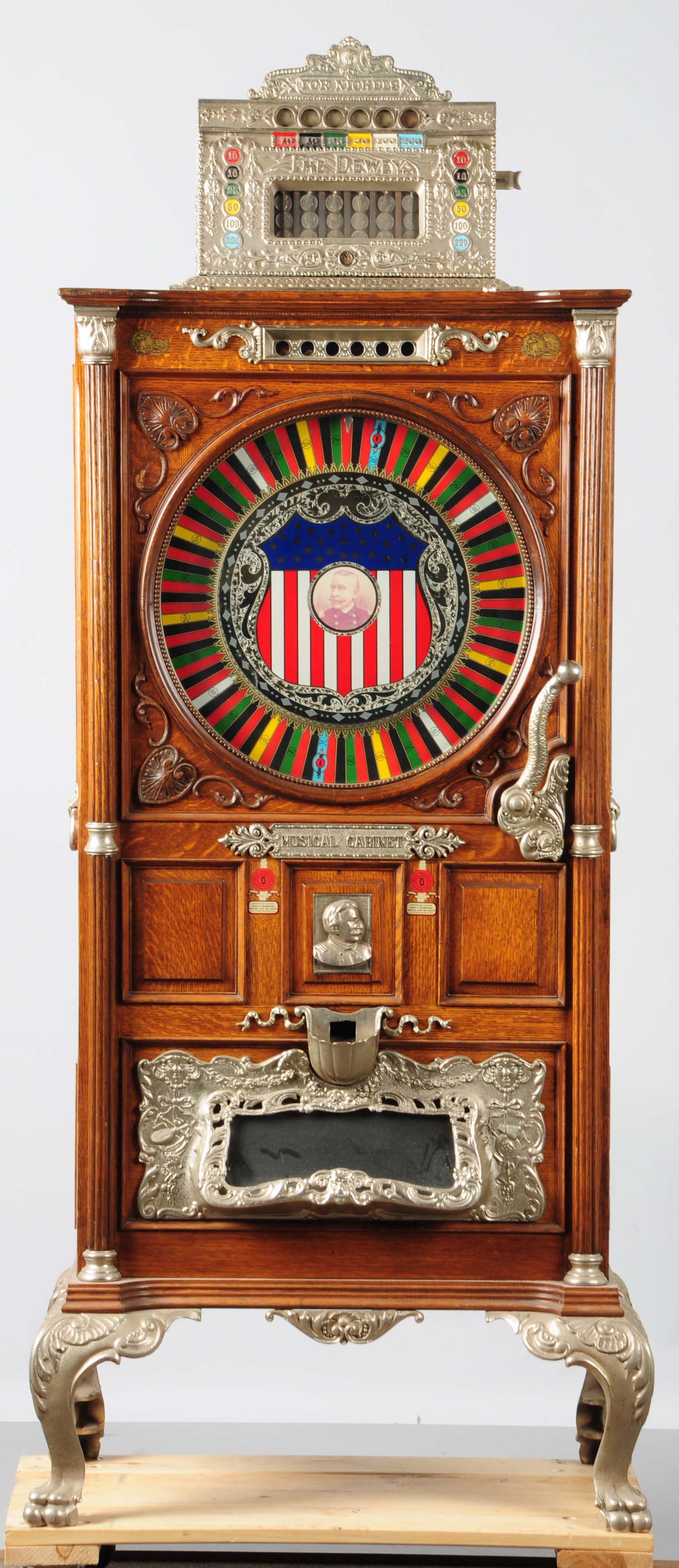 Mills 5-cent Dewey musical upright slot machine, working order with excellent repertoire of tunes. Est. $15,000-$18,000. Morphy Auctions image.
